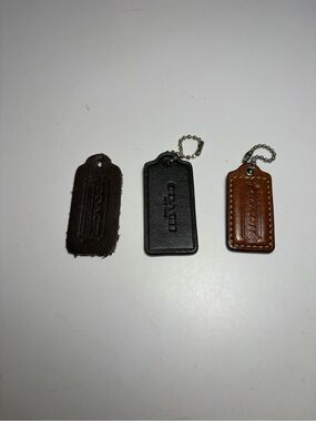 Coach Leather Key & Card Tag Trio in Black, Dark Brown, and Tan